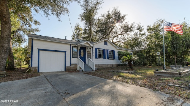 ranch-style home featuring a garage