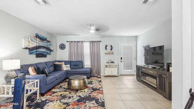 living room with light tile patterned floors and visible vents