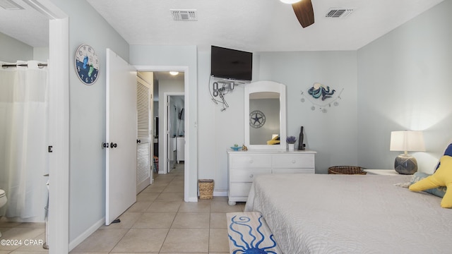 bedroom featuring ceiling fan, visible vents, and light tile patterned flooring