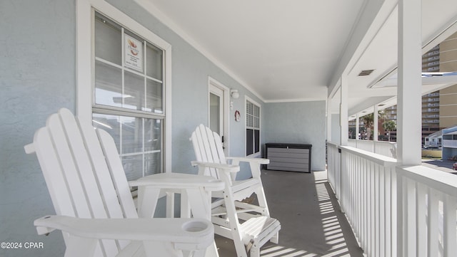 balcony with visible vents and covered porch