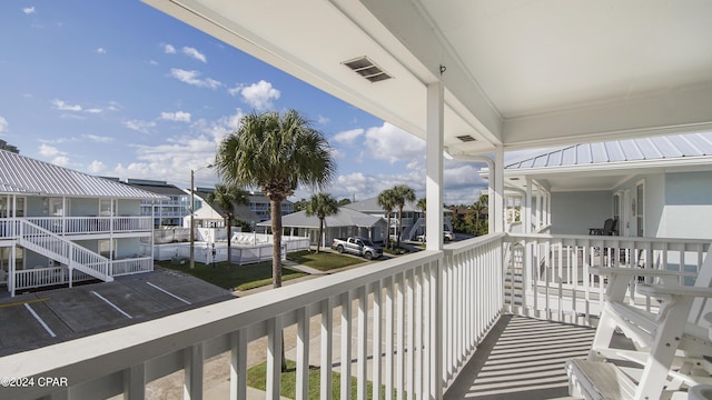 balcony with a residential view and visible vents