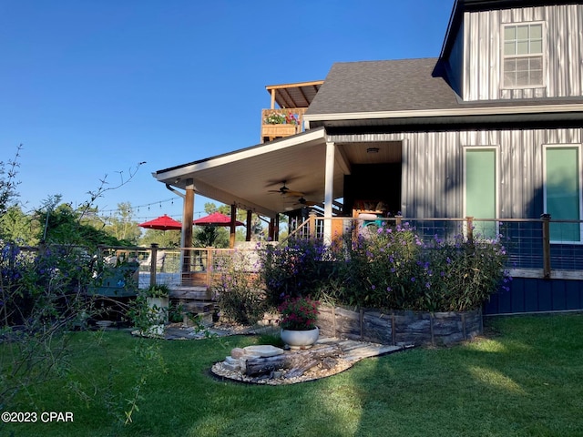 exterior space with ceiling fan