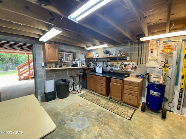 basement with a workshop area