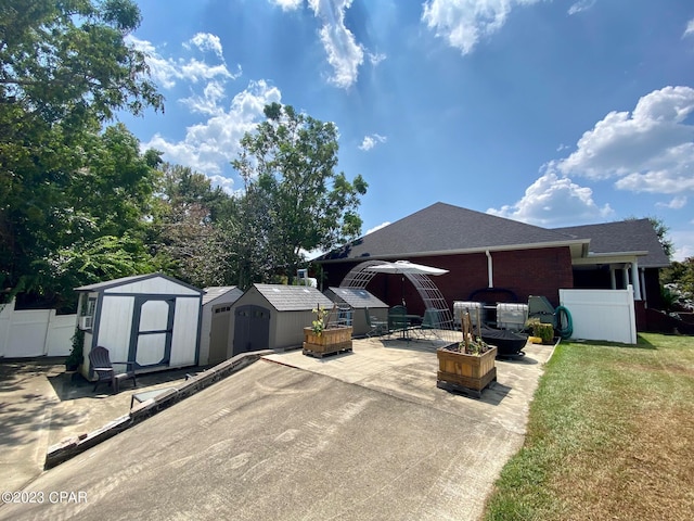 view of patio / terrace with a storage unit