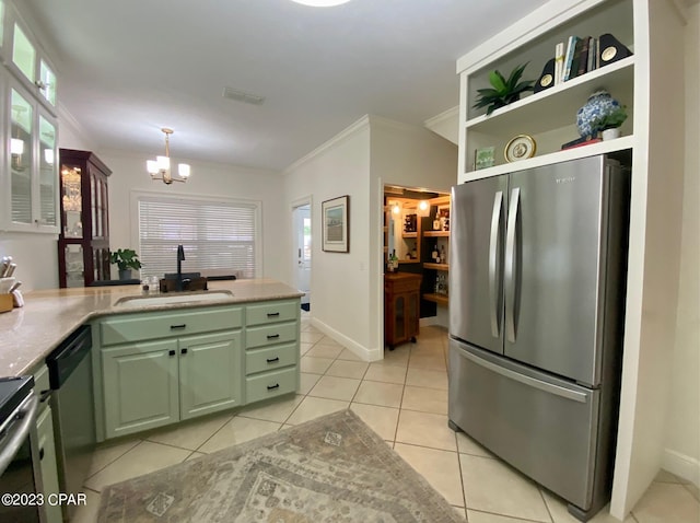 kitchen with sink, stainless steel appliances, ornamental molding, light tile patterned flooring, and green cabinetry