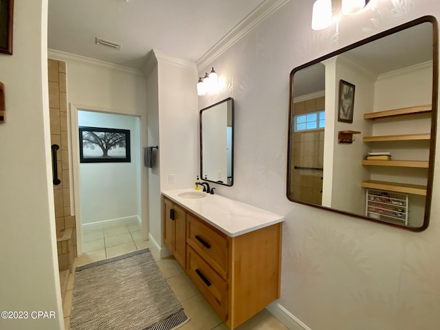 bathroom with tile patterned flooring, vanity, crown molding, and walk in shower