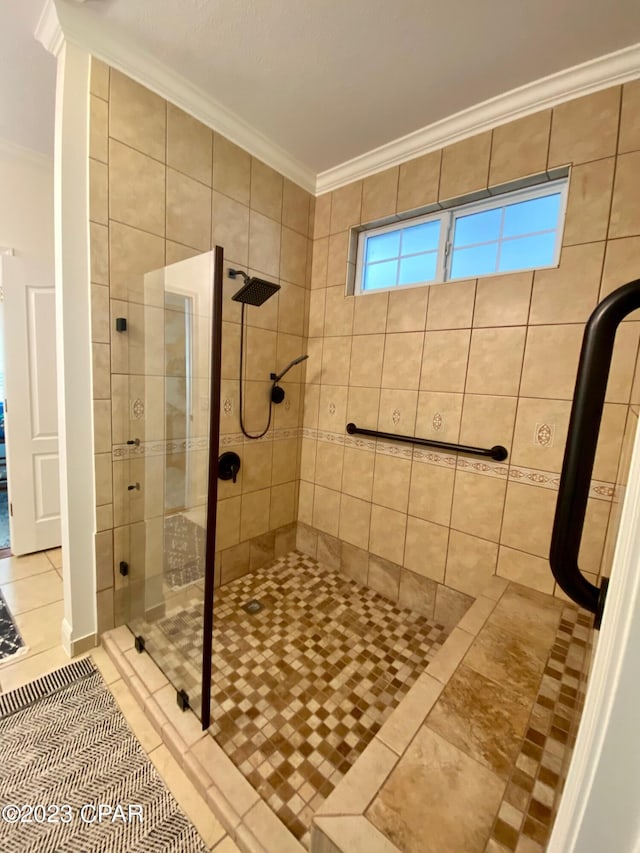 bathroom featuring tile patterned flooring, walk in shower, and ornamental molding