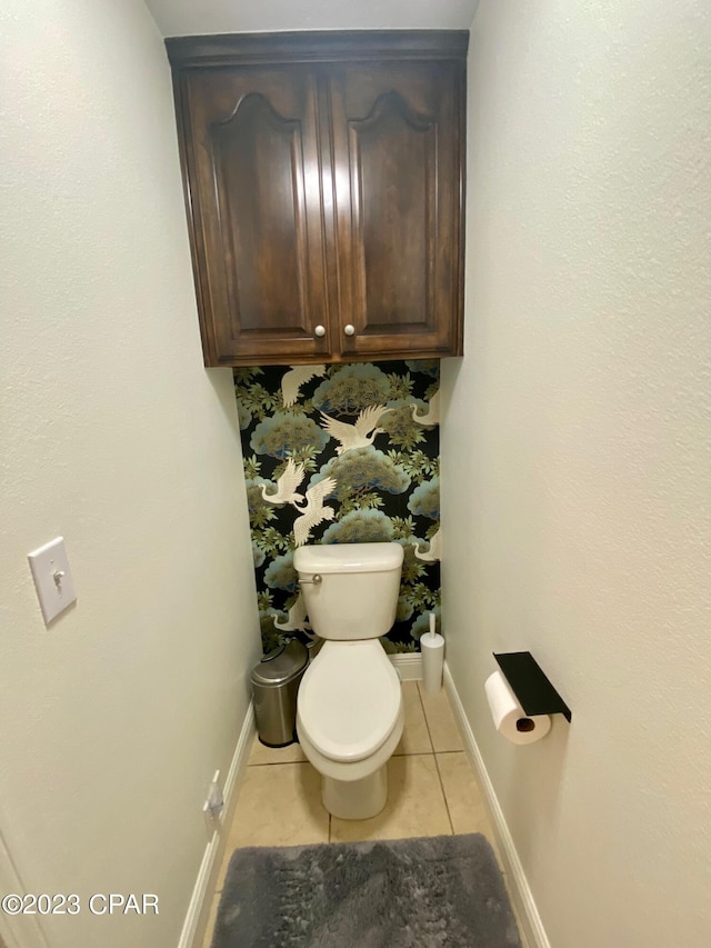 bathroom with tile patterned floors and toilet