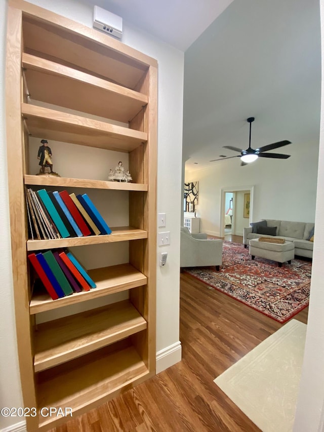 interior space with hardwood / wood-style floors and built in features