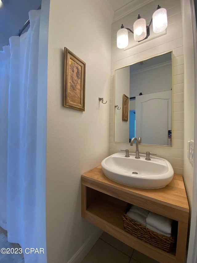 bathroom featuring vanity and ornamental molding