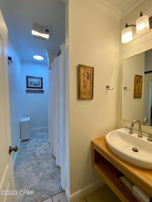 bathroom featuring tile patterned flooring, a shower with curtain, vanity, and crown molding