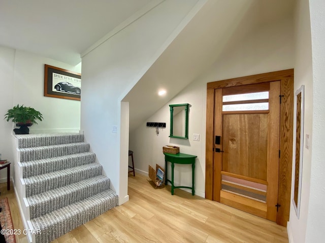 foyer entrance with light hardwood / wood-style floors