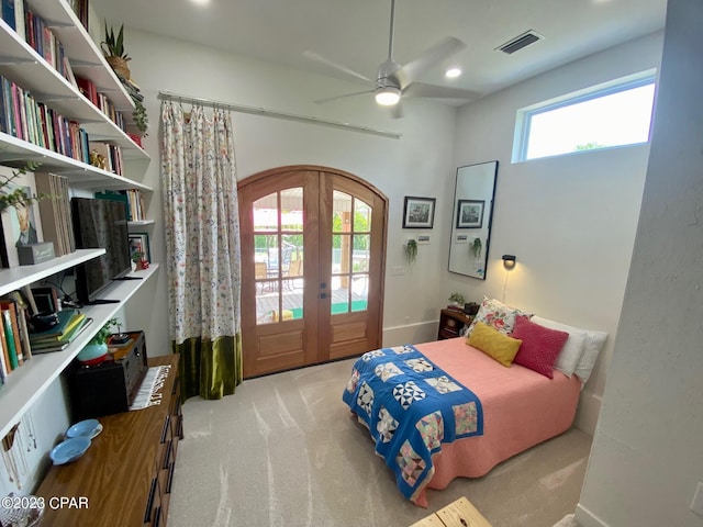 carpeted bedroom featuring access to exterior, french doors, and ceiling fan