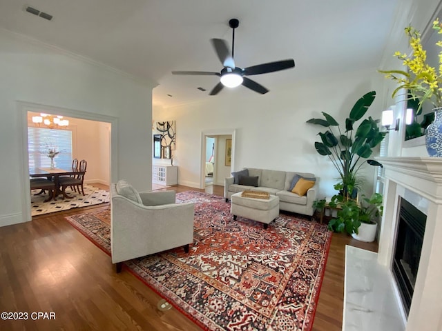 living room featuring ceiling fan, crown molding, and hardwood / wood-style flooring