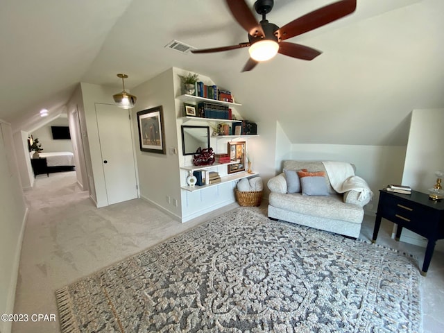 interior space with ceiling fan and vaulted ceiling