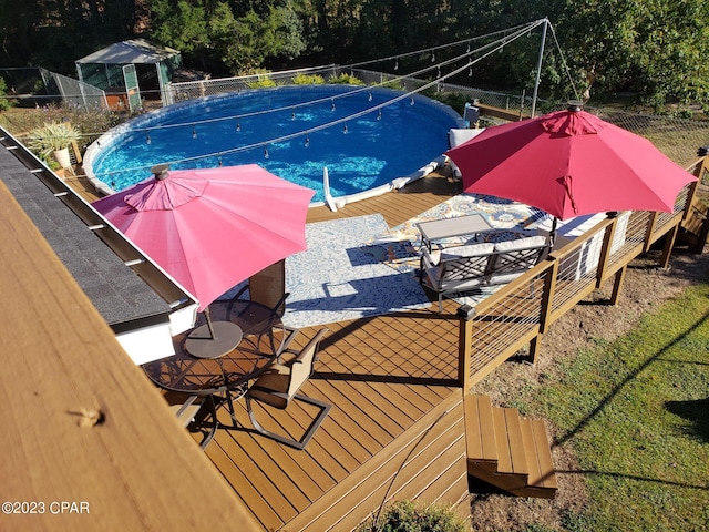 view of pool featuring a deck