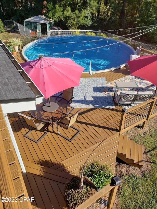 view of pool with a deck