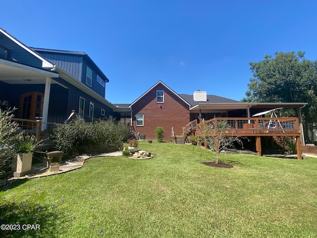 view of yard with a wooden deck