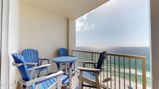 balcony with a view of the beach and a water view