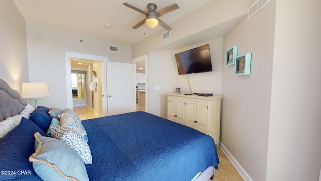 bedroom featuring ensuite bathroom and ceiling fan