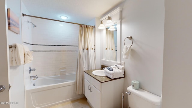 full bathroom featuring shower / tub combo with curtain, vanity, toilet, and tile patterned flooring