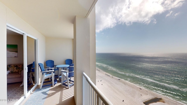 balcony with a beach view and a water view