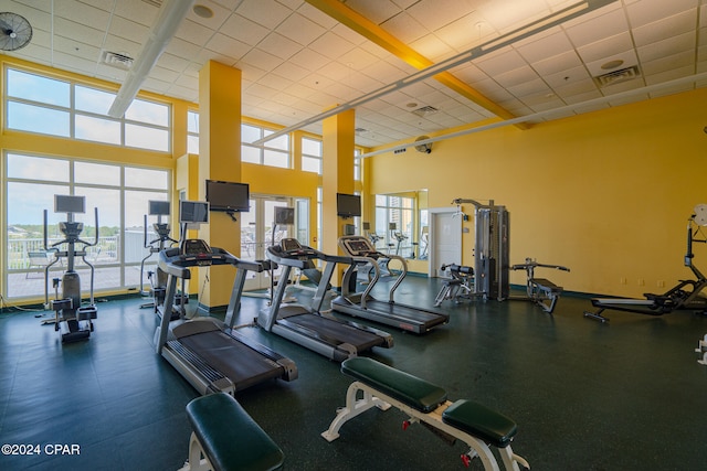 workout area with a paneled ceiling