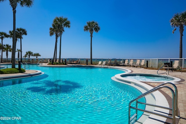 view of swimming pool featuring a community hot tub