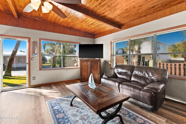 living room featuring hardwood / wood-style floors, vaulted ceiling with beams, ceiling fan, and wooden ceiling