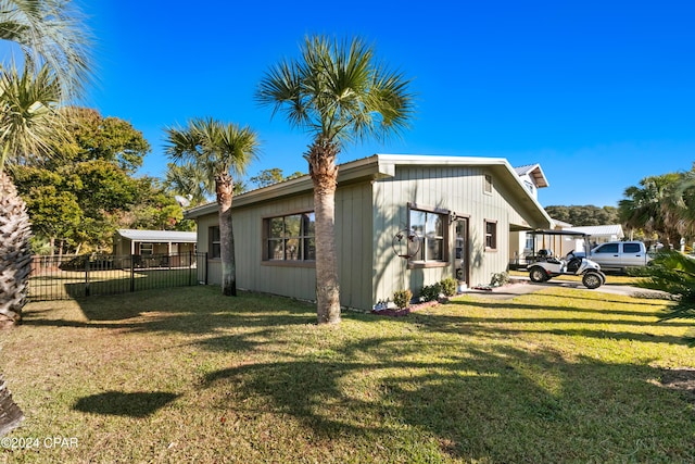 view of home's exterior with a yard