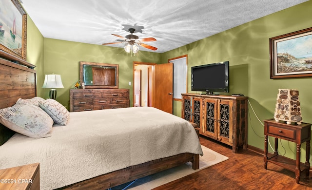 bedroom with ceiling fan and dark wood-type flooring