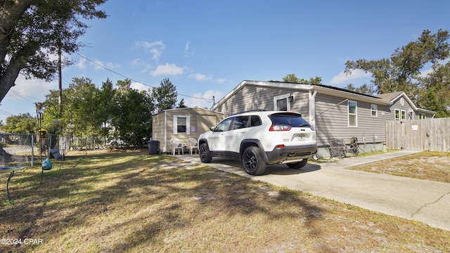 view of side of home with a lawn