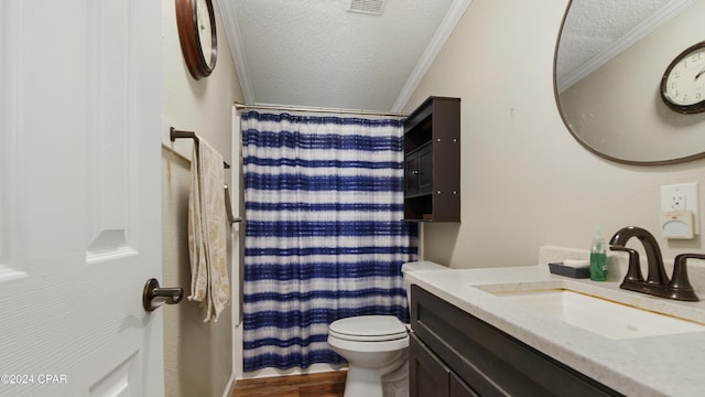 bathroom with crown molding, hardwood / wood-style floors, vanity, a textured ceiling, and toilet