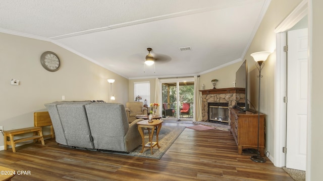 living room with vaulted ceiling, dark hardwood / wood-style floors, ceiling fan, and crown molding