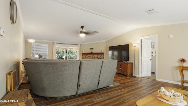 living room with vaulted ceiling, dark hardwood / wood-style floors, ceiling fan, and crown molding