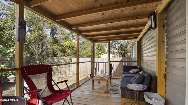 sunroom with wooden ceiling and beam ceiling