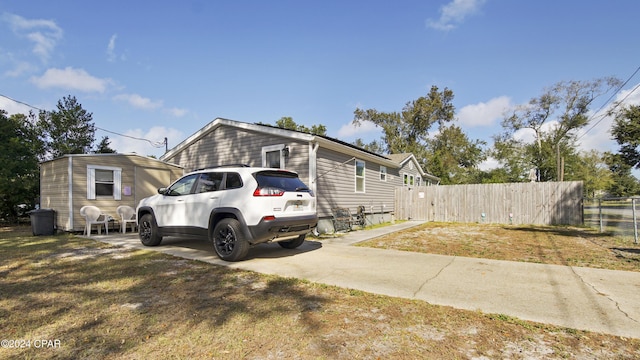 view of property exterior with a lawn