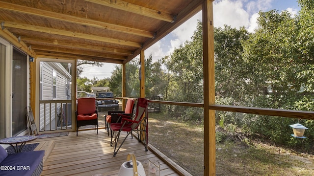 sunroom / solarium featuring wood ceiling and beam ceiling