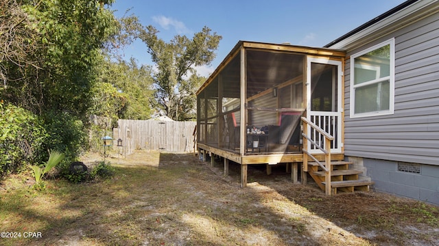 view of yard with a sunroom