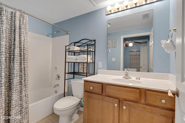 full bathroom featuring toilet, ceiling fan, tile patterned flooring, a textured ceiling, and vanity