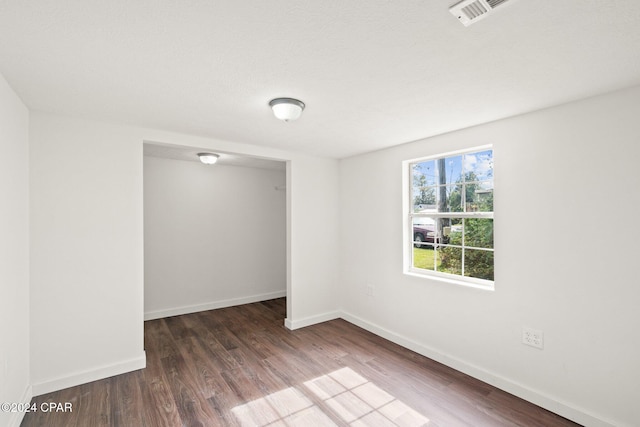 empty room featuring dark hardwood / wood-style floors