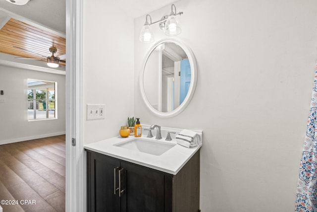 bathroom featuring hardwood / wood-style floors, wooden ceiling, ceiling fan, and vanity