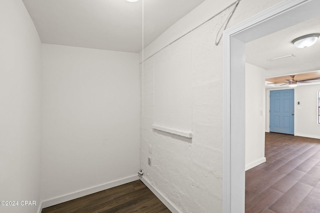 interior space featuring ceiling fan and dark hardwood / wood-style flooring