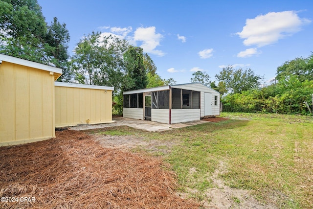 view of yard with a sunroom