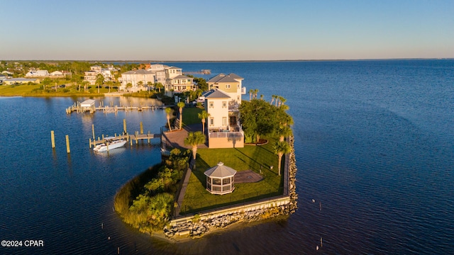 aerial view at dusk with a water view