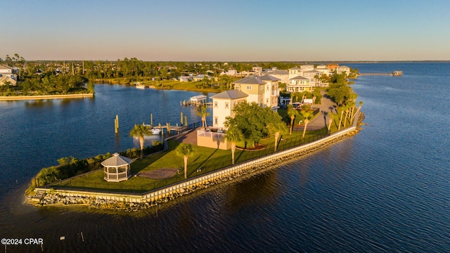 aerial view at dusk with a water view