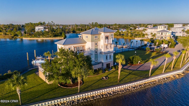 birds eye view of property featuring a water view