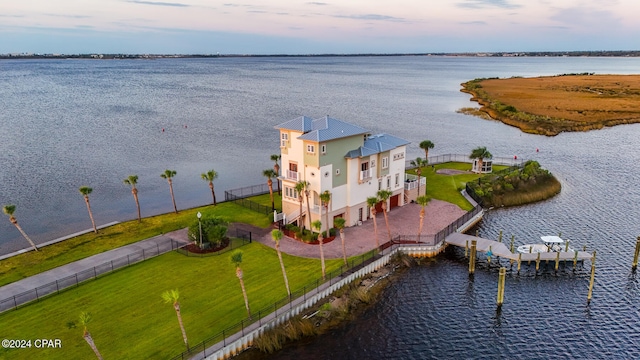 aerial view at dusk with a water view