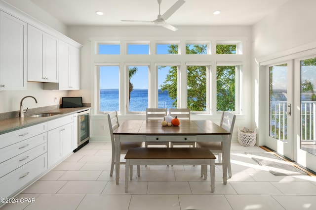 kitchen with white cabinets, sink, and plenty of natural light