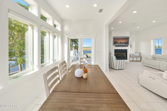 dining room featuring a healthy amount of sunlight and light tile patterned flooring